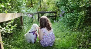 Child with dog in a garden